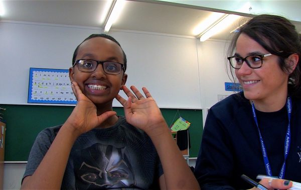 A boy and teacher in the short film Overcoming Barriers