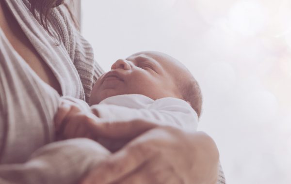A baby in a mother's arms