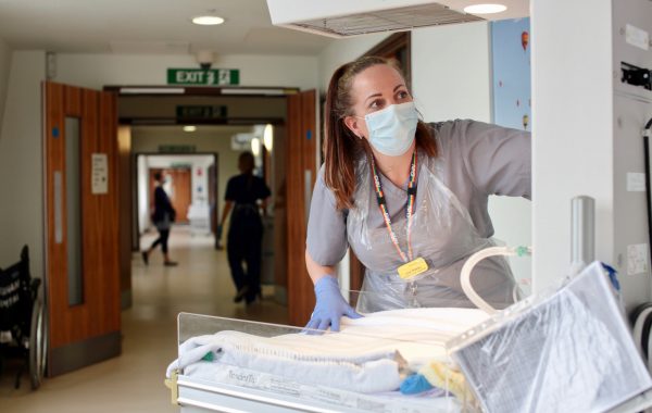An NHS worker in a face mask