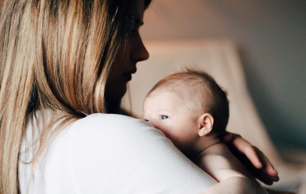 A mother comforts her baby