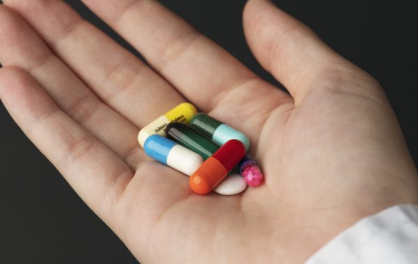 A selection of pills in a person's hand