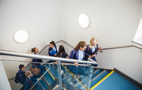 Students walking up stairs in a secondary school