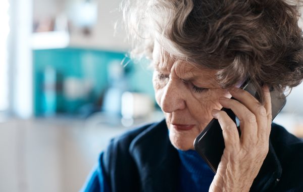 An older person on the phone