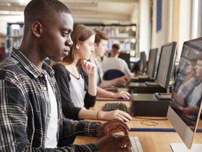 Students using computers in a university library