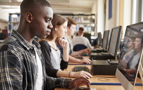 Students using computers in a university library