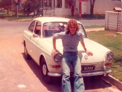 Mike Bell leans on the car he bought from Dustin Hoffman