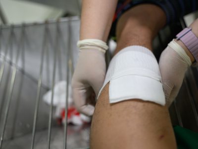 A wound being cleaned and dressed