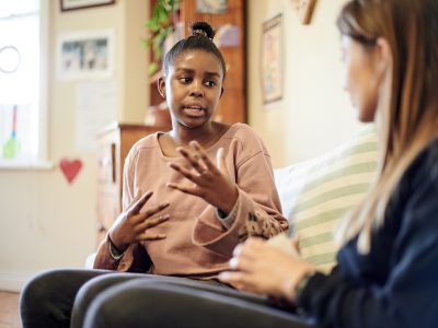 Young person talking to a therapist