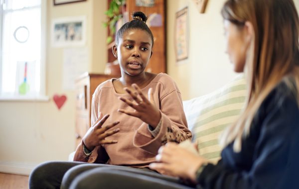 Young person talking to a therapist